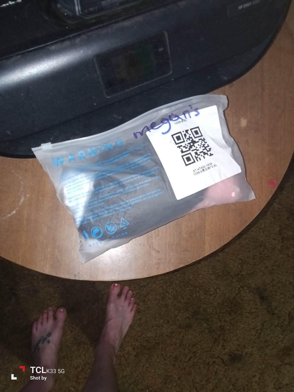 Clear Plastic Packaging with QR Label - Black Item Inside